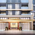 Modern High Rise Apartment Entrance Gate With Golden Canopy Glass Doors And Green Plants