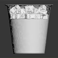 Stainless Steel Ice Bucket Filled With Ice Cubes On Reflective Surface