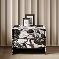Modern Nightstand With Black And White Marble Top Two Photo Frames White Cup And Magazine