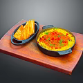 Yellow Rice Dish With Red Seasoning And Potato Strips On Wooden Tray Black Pots
