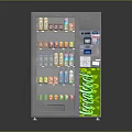 Silver Metal Vending Machine With White Panel Green Coca-Cola Logo And Control Panel