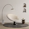 Modern White Curved Accent Chair With Arched Floor Lamp Round Side Table And Gray Rug