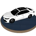 White Toyota Camry Sedan on Blue Display Stand with Black Background