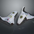 Two White Protective Gear Pieces With Yellow Black Patterns And Ergonomic Design 3d model
