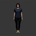 A Woman Standing Barefoot in Blue T-Shirt and Black Pants Against Gray Background