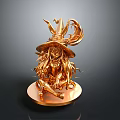 Golden Decorative Figurine As Lifestyle Product With Hat Wearing Character Sitting On Round Base