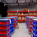 Warehouse Interior With Red And Blue Metal Storage Shelves Arranged In Rows