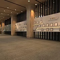 Spacious Hall Featuring Long Display Walls Awards Columns and Ceiling Lights on Carpeted Floor