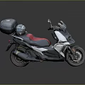 Sleek White Black Scooter Motorcycle With Red Black Seat And Black Top Case