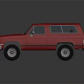 Red Vintage SUV with Classic Front Grille and Rugged Off Road Tires