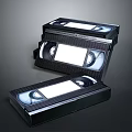 Open Black VHS Video Cassette Tapes With Plastic Cases On Dark Background