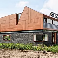 Modern Detached Villa Exterior With Wooden Facade Stone Wall Sloped Roof And Large Windows