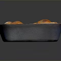 Golden Brown Sweet Rolls In Blue And White Baking Dish With Frosting