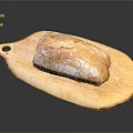Fresh Crusty Bread Loaf on Wooden Cutting Board Surface