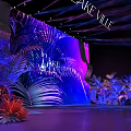 Stunning Floral Installation In Lake Ville With Tropical Plant Backdrop And Purple Blue Lighting