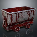 Vintage Mine Cart Featuring Rusty Red and Gray Metal Body with Wheels on Dark Surface