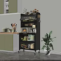 Modern Black Wheeled Kitchen Sideboard With Microwave Dishes Jars And Potted Plant