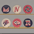 Colorful Circular Logos With Various Letters On Two Wooden Shelves