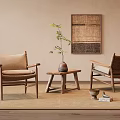 Light Tone Leisure Chairs With Wooden Frame Woven Details Near Small Table And Decorative Art