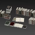 Various Stacked and Open Books with Different Sizes Colors and Covers on Black Background