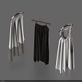 Three Stylish Clothing Pieces Hanging on Hangers White Sleeveless Dress Dark Skirt and White Dress