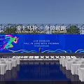 Marathon Event Venue With Blue Backdrop Stage And White Seats