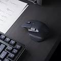 Ergonomic Wireless Mouse On Modern Desktop With Mechanical Keyboard And Notebook Paper Setup