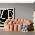Peach Button tufted Sectional Sofa With Gray Blanket Decorative Ball And Black White Abstract Painting