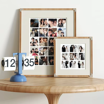 Stylish Decorative Ornament Set With Framed Family Photos And Small Clock On Wooden Table 3d model