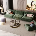 Modern Living Room With Green Sofa Round Coffee Table Armchair Throw Pillows And Floor Plant