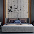 Double Bed with Textured Gray Wall Black Gold Butterfly Decorations Purple Blue Pillows and Bedside Lamps