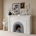 Ornate White Fireplace with Carved Mantel Featuring Framed Pictures Statues Vase and Bust Sculpture