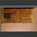 Decorative Indoor Setting Featuring Orange Gold Patterned Chest With Pink Walls And Golden Grille Structure