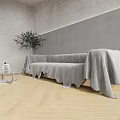 Modern Multi person Sofa Covered with Gray Blanket and Glass Coffee Table Near Green Plant