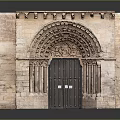 Historic Stone Gate With Arched Top Carved Decorations Wooden Door And Surrounding Stone Pillars