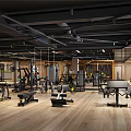 Modern Gym With Various Fitness Equipment Wooden Floor And Black Ceiling Beams