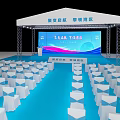 Event Venue Setup With White Tent Stage Blue Floor And Neatly Arranged White Chairs