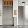 Stainless Steel Elevators In Modern Lobby Interior With Marble Walls Wooden Slat And Potted Plant