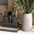 Modern Kitchen Utensils On Countertop With Wooden Cutting Boards Metal Canisters And Green Plant