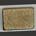 Natural Stone Block Featuring Rustic Brown Green Surface Texture On White Pad 3d model