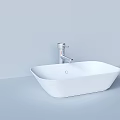 White Square Washbasin with Silver Faucet on Light Colored Wall and Countertop
