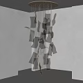 Modern Chandelier With Irregular Dark Green Glass Pieces Hanging In Minimalist Room
