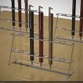 Different Colored Pens Placed in Metal Pen Holders on Wooden Table