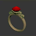 Elegant Gold Ring With Red Gemstone And Decorative Metal Details