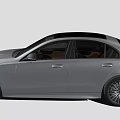 Silver Modern Sedan Car With Sleek Body Black Wheels And Taillights