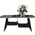 Modern Dining Table With Marble Top Black Metal Legs And White Flower Bouquet