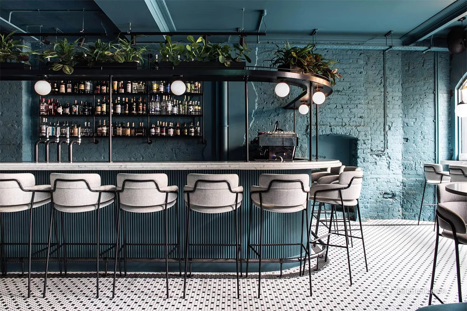 Modern Bar Interior With Bar Counter High Stools Green Plants Wine Shelves And Brick Wall 3d model 