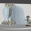 Elegant Wedding Decor With White Curved Backdrop Floral Arrangements And Small Round Table