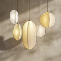 Modern Minimalist Pendant Lights with Oval Shaped White and Beige Design on Gray Wall Background