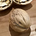 Whole and Shelled Walnuts with Fresh Mint Leaf on Wooden Surface 3d model